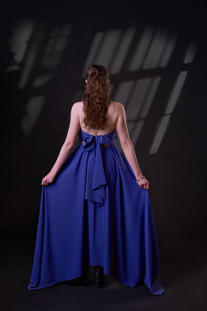 Back of the cobalt blue gown with a sculpted bow and full skirt
