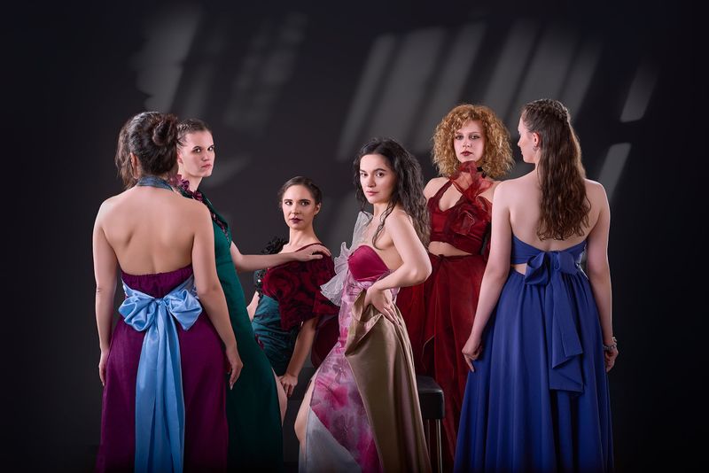 The evening wear collection from behind, showing bows, open backs and trains