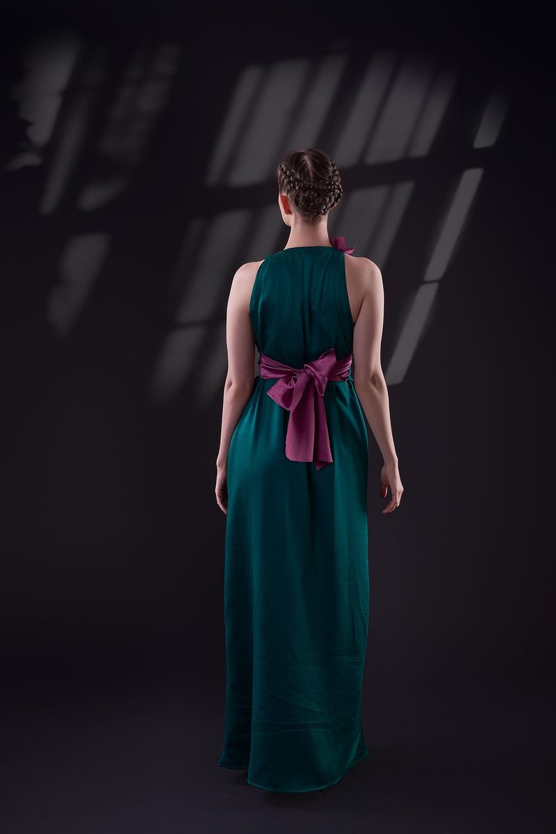 Back of the teal halter gown tied with a large plum satin bow